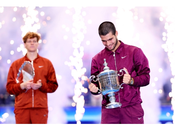 Carlos Alcaraz of Spain poses with his trophy after defeating Jannik Sinner of Italy during their Men's Singles Final match on Day Fifteen of the 2025 US Open at USTA Billie Jean King National Tennis Center on September 07, 2025 in New York City. Clive Brunskill/Getty Images/AFP