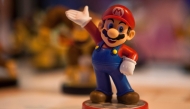 (Files) This file photo taken on October 2, 2015 shows a figurine representing Japanese multinational Nintendo's famous video game character Mario Bros on display during the Madrid Games Week 2015 in Madrid. (Photo by Sebastien Berda / AFP) 