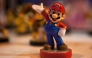 (Files) This file photo taken on October 2, 2015 shows a figurine representing Japanese multinational Nintendo's famous video game character Mario Bros on display during the Madrid Games Week 2015 in Madrid. (Photo by Sebastien Berda / AFP) 