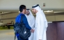 Aspire Academy officials welcome a student.
