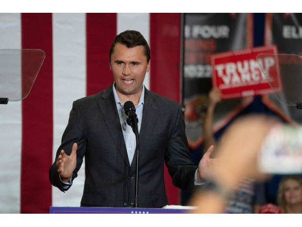 (FILES) Charlie Kirk, Founder and President of Turning Point USA, addresses the crowd at a rally with US Senator and Republican vice presidential candidate JD Vance during a campaign rally at Arizona Christian University Event Center in Glendale, Arizona, on July 31, 2024. (Photo by Laura SEGALL / AFP)
