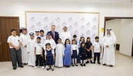 Officials with children during the opening ceremony.