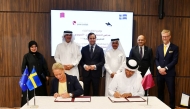 Minister of State for Foreign Trade Affairs at MoCI, H E Dr. Ahmed bin Mohamed Al-Sayed; Minister of International Development Cooperation and Foreign Trade of Sweden, H E Benjamin Dousa; Chairman of QC Sheikh Khalifa bin Jassim bin Mohamed Al Thani with other officials during the agreement signing.