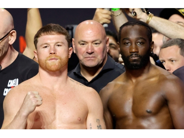 Canelo Alvarez (L) and Terence Crawford pose during a ceremonial weigh-in at T-Mobile Arena on September 12, 2025 in Las Vegas, Nevada. Steve Marcus/Getty Images/AFP 