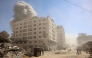 Smoke billows after an Israeli strike on a building in Gaza City's Tal al-Hawa district on September 13, 2025. (Photo by Omar AL-QATTAA / AFP)
