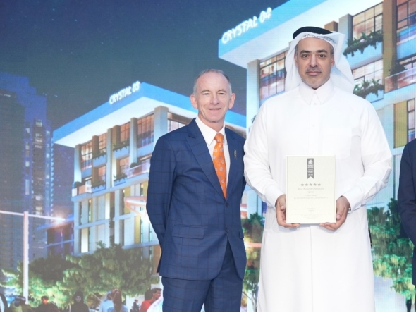 President and CEO of UDC Yasser Al Jaidah with the award at 2025–2026 Arabian Property Awards event.