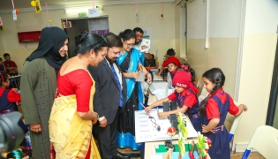 School officials and guests visiting a stall set up by the students