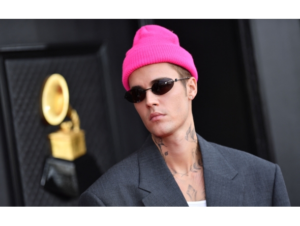 File: Canadian singer and songwriter Justin Bieber arrives for the 64th Annual Grammy Awards at the MGM Grand Garden Arena in Las Vegas, on April 3, 2022. (Photo by Angela Weiss / AFP)

