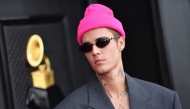 File: Canadian singer and songwriter Justin Bieber arrives for the 64th Annual Grammy Awards at the MGM Grand Garden Arena in Las Vegas, on April 3, 2022. (Photo by Angela Weiss / AFP)


