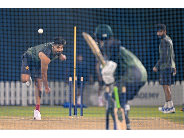 Pakistan's Haris Rauf bowls during a practice session at the International Cricket Council (ICC) Academy in Dubai on September 16, 2025, ahead of their Asia Cup 2025 Twenty20 international cricket match against the UAE. (Photo by Sajjad Hussain / AFP)
