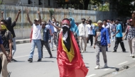 University students protest against the parliament's plan to purchase SUVs for lawmakers on a street in Dili, East Timor, on September 16, 2025. (Photo by Valentino Dariell De Sousa / AFP)