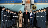 US President Donald Trump (C) and US First Lady Melania Trump disembark from Air Force One after landing at Stansted Airport, eastern England, on September 16, 2025. (Photo by Andrew Caballero-Reynolds / AFP)