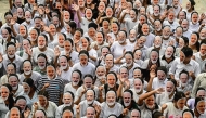 Students wear masks of India's Prime Minister Narendra Modi to celebrate his 75th birthday, in Chandigarh on September 17, 2025. (Photo by AFP)
