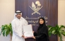 Minister of Justice and Minister of State for Cabinet Affairs H E Ibrahim bin Ali Al Mohannadi presenting a certificate at the event.
