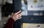 (Files) In this picture taken on September 9, 2020 an Alzheimer's patient stands at the entrance of the hairdressing salon in Dax, southwestern France. (Photo by Philippe Lopez/ AFP)