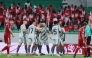 Al Duhail's Adil Boulbina (third left) celebrates with teammates.