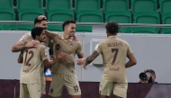 Rodrigo Moreno (second right) celebrates with teammates after scoring Al Rayyan's first goal.