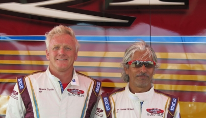 Qatar’s Sheikh Hassan and his partner Steve Curtis pose for a photo. 