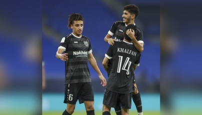 Al Bidda’s Abdallah Ahmed Nouri jumps as he celebrates with teammates during the match against Al Sadd at Stadium 974 yesterday.