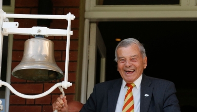 File: Retired umpire Dickie Bird rings the five minute bell during play on the first day of the first cricket Test match between England and New Zealand at Lord's cricket ground in London on May 21, 2015. (Photo by Ian Kington / AFP) 
