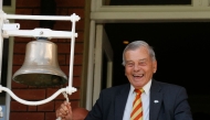 File: Retired umpire Dickie Bird rings the five minute bell during play on the first day of the first cricket Test match between England and New Zealand at Lord's cricket ground in London on May 21, 2015. (Photo by Ian Kington / AFP) 