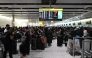 Travellers wait in terminal 4 at Heathrow Airport, west of London on September 20, 2025. Photo by JUSTIN TALLIS / AFP

