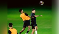 Al Sadd's Roberto Firmino (right) with a teammate during a training session.