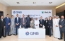 QNB and MetLife officials pose for a group photo during the signing of agreement.