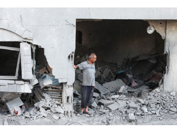 A Palestinian man reacts as he checks the rubble of a building hit by an Israeli strike in the Nuseirat refugee camp in the central Gaza Strip, on September 25, 2025, as Israel presses its air and ground offensive. (Photo by Eyad BABA / AFP)

