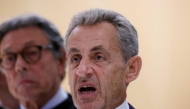 Former French president Nicolas Sarkozy reacts after the verdict in his trial for illegal campaign financing from Libya for his successful 2007 presidential bid, at the Tribunal de Paris courthouse in Paris, on September 25, 2025. (Photo by Alain Jocard / AFP)
