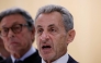 Former French president Nicolas Sarkozy reacts after the verdict in his trial for illegal campaign financing from Libya for his successful 2007 presidential bid, at the Tribunal de Paris courthouse in Paris, on September 25, 2025. (Photo by Alain Jocard / AFP)
