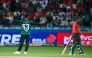 Pakistan's Saim Ayub (L) celebrates after dismissing Bangladesh's Nurul Hasan (R) during the Asia Cup 2025 Super Four Twenty20 international cricket match between Bangladesh and Pakistan at the Dubai International Stadium in Dubai on September 25, 2025. (Photo by Sajjad HUSSAIN / AFP)