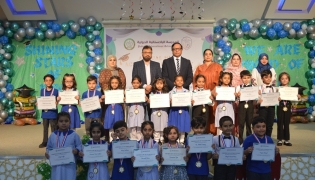 School officials and students during the Annual Prize Distribution Ceremony.