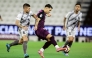 Al Sadd's Agustín Soria and Al Duhail's Marco Verratti (left) vie for the ball.