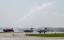 A firefighter gives a water cannon salute to India's MiG-21 fighter jets during their farewell ceremony at the Chandigarh Air Force Station in Chandigarh on September 26, 2025. (Photo by AFP)
