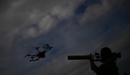 A soldier of the German armed forces Bundeswehr demonstrates the use of a handheld HP 47 drone jammer during a drone defence exercise in Hamburg, northern Germany, on September 26, 2025. (Photo by Tobias Schwarz / AFP)
