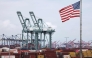 An American flag flies in front of shipping containers and cranes at the Port of Los Angeles on September 26, 2025 in Los Angeles, California. Mario Tama/Getty Images/AFP 