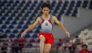 This picture taken on August 30, 2024 shows Indonesian gymnast Naufal Takdir Al Bari representing East Java competing at the 21st National Sports Week in Deli Serdang, North Sumatra. (Photo by Hendra Syamhari / AFP)