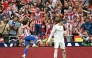 Atletico Madrid's Argentine forward #19 Julian Alvarez celebrates with supporters scoring his team's fourth goal in spite of Real Madrid's Belgian goalkeeper #01 Thibaut Courtois during the Spanish league football match between Club Atletico de Madrid and Real Madrid CF at the Metropolitano stadium in Madrid on September 27, 2025. (Photo by Javier SORIANO / AFP)
