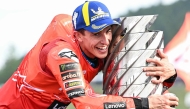 Ducati Lenovo Team's Spanish MotoGP rider Marc Marquez celebrates with the trophy after the MotoGP class race of the MotoGP Japanese Grand Prix at the Mobility Resort Motegi on September 28, 2025. (Photo by Toshifumi Kitamura / AFP)