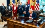 US President Donald Trump speaks with the press during the signing of executive orders in the Oval Office, in Washington DC, on September 25, 2025. (Photo by Demetrius Freeman/The Washington Post)