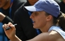 Poland's Iga Swiatek signs autographs for fans after her women's singles match against Colombia痴 Camila Osorio at the China Open tennis tournament in Beijing on September 29, 2025. (Photo by Pedro Pardo / AFP)