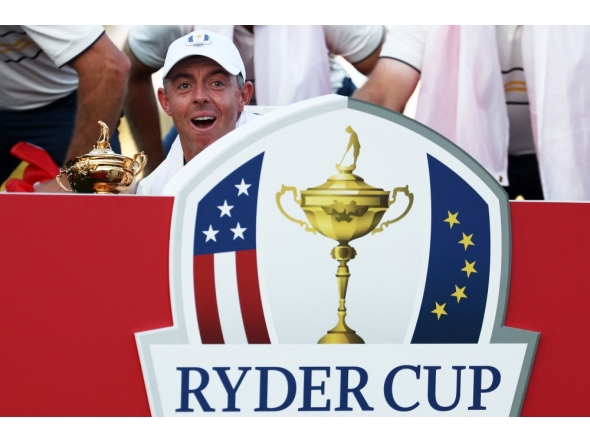 Rory McIlroy of Team Europe celebrates with the Ryder Cup after Team Europe's 15-13 win over Team United States on September 28, 2025 in Farmingdale, New York. Jared C. Tilton/Getty Images/AFP 
