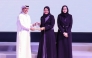 MoEHE Undersecretary H E Dr. Ibrahim bin Saleh Al-Nuaimi honouring a representative of a winning school.