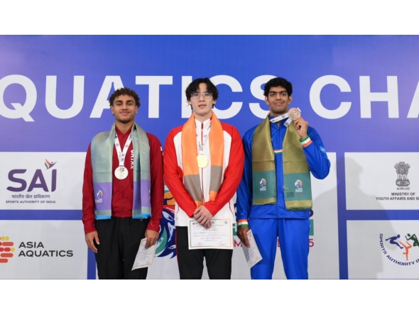 Qatar's Ali Tamer (left) celebrates on the podium with gold winner Wang of China and India’s Srihari Natraj who won the bronze, in the 100m freestyle event. 