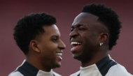 File: Real Madrid's Brazilian forward #11 Rodrygo (left) and Real Madrid's Brazilian forward #07 Vinicius Junior take part in a training session at the Emirates stadium in London on April 7, 2025. (Photo by Adrian Dennis / AFP)
