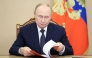 In this pool photograph distributed by the Russian state agency Sputnik, Russia's President Vladimir Putin holds an operational meeting via videoconference with permanent members of the Russian Security Council in Moscow on October 1, 2025. (Photo by Aleksey Babushkin / POOL / AFP)
