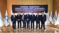 Officials pose for a group photo during the signing of agreement.