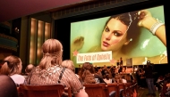 Taylor Swift fans listen to a song during a listening event for Swift's new album 'The Life of a Showgirl' at the Astor Theatre in Melbourne on October 3, 2025. Photo by William WEST / AFP