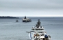 This handout picture taken and released by The Finnish Border Guard on March 2, 2025 shows the Border Guard ship Turva (front) escorting Cook Islands registered oil tanker Eagle S out to sea near Porvoo (Borga), Finland. Photo by Handout / various sources / AFP

